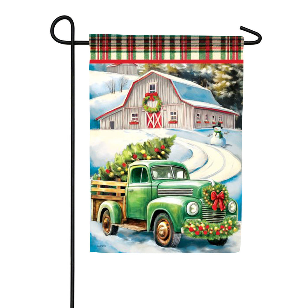 Carson Delivering Christmas Garden Flag